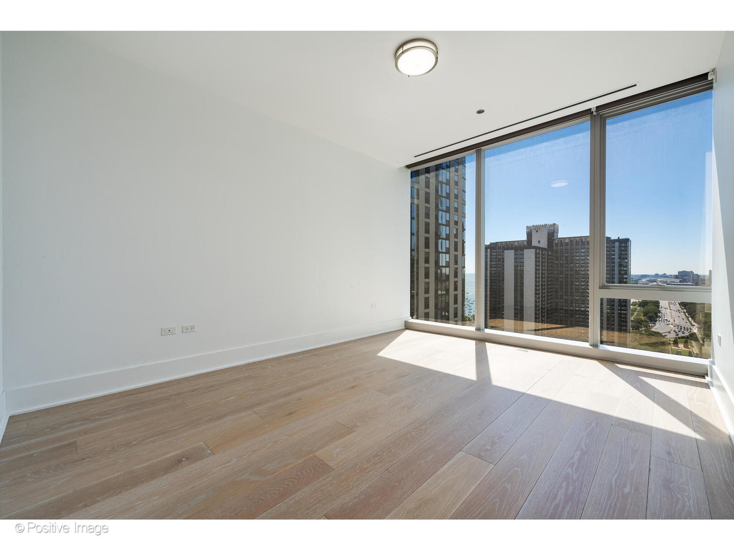 363 East Wacker Drive, Unit 1903 Chicago, IL 60601 - Photo 19 of 39 a view of an empty room with glass door