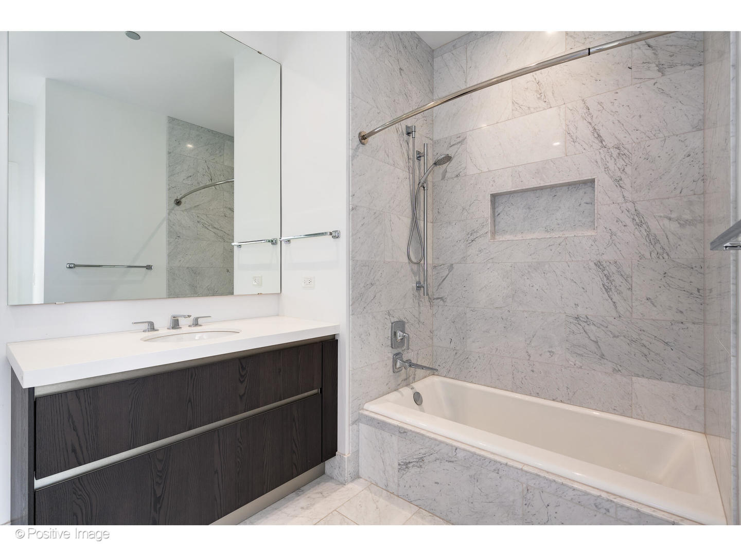 363 East Wacker Drive, Unit 1903 Chicago, IL 60601 - Photo 22 of 39 a bathroom with a sink mirror toilet and bathtub