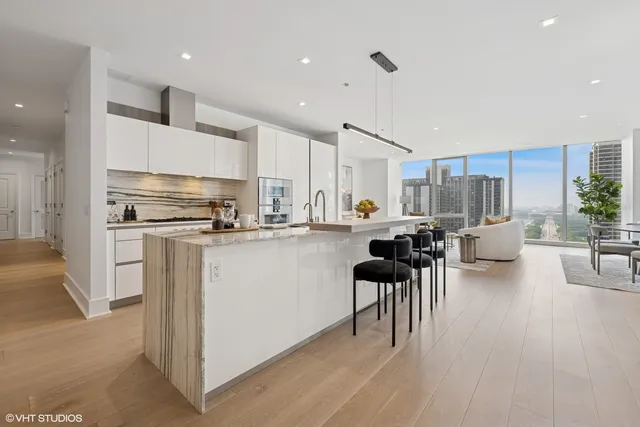 a kitchen with a sink dishwasher a stove and a refrigerator with wooden floor