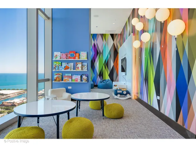 a view of a room with furniture and wooden floor