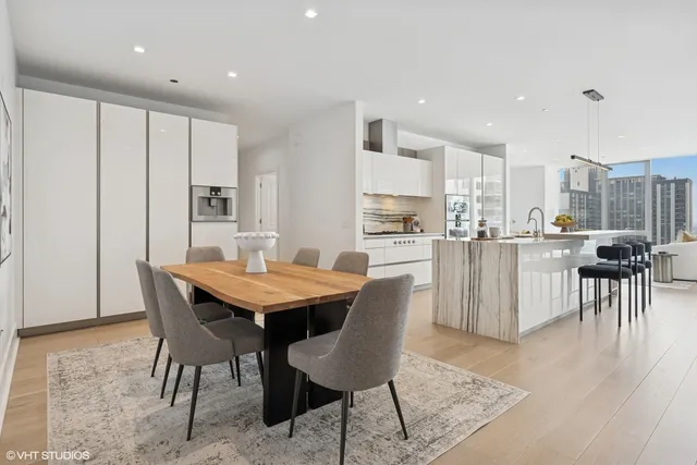 a dining room with furniture and wooden floor