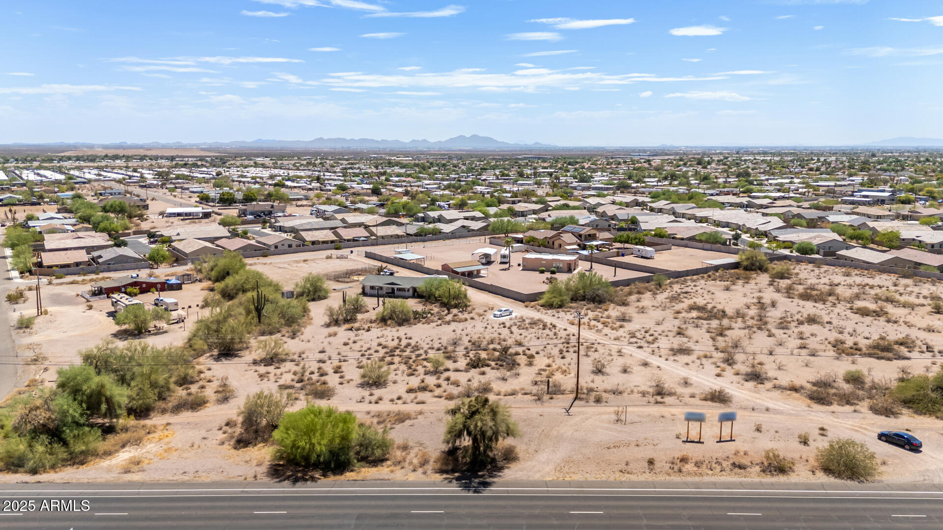 1955 East Old West Highway, Unit 2 Apache Junction, AZ 85119 - Photo 10 of 17 an aerial view of residential building and parking space