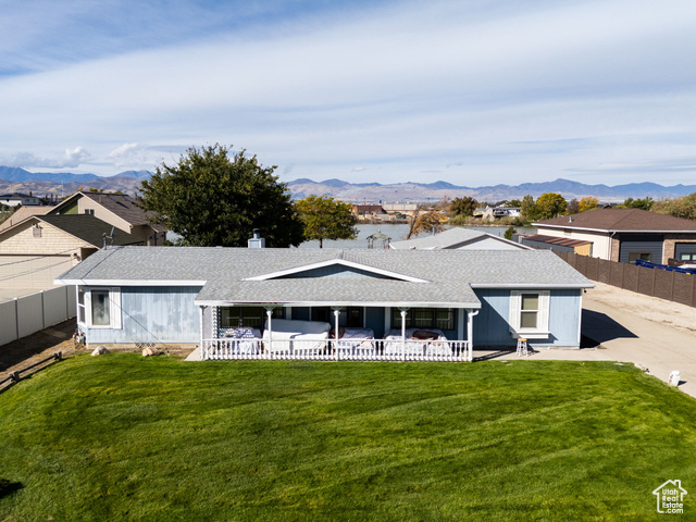 12958 South 300 East Draper, UT 84020 - Photo 10 of 38 View of front of home featuring a shingled roof, a mountain view, a residential view, and a chimney