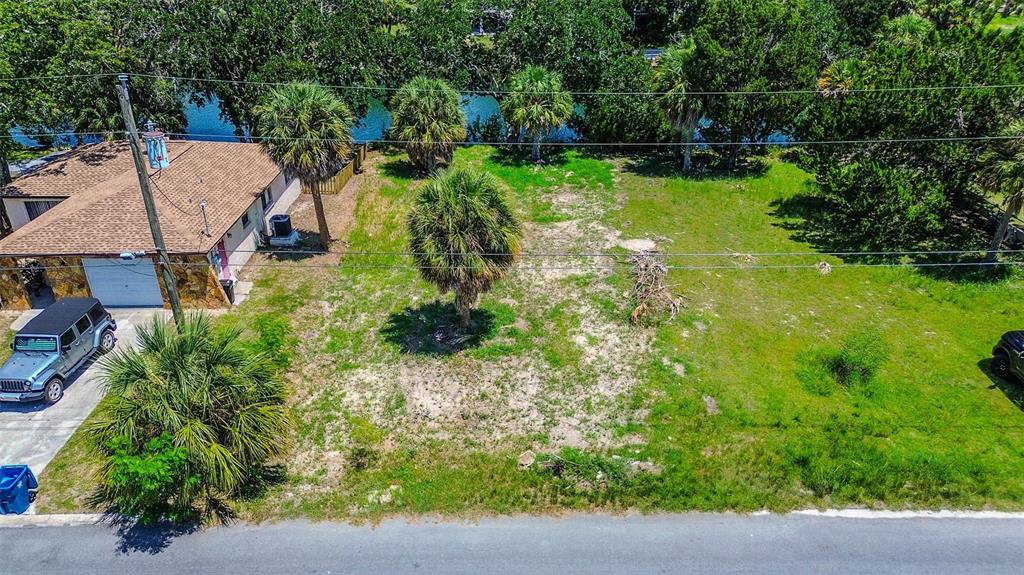 0 Sea Grape Drive, Unit LOT 10 Hernando Beach, FL 34607 - Photo 12 of 23 an aerial view of a house with a yard basket ball court and outdoor seating