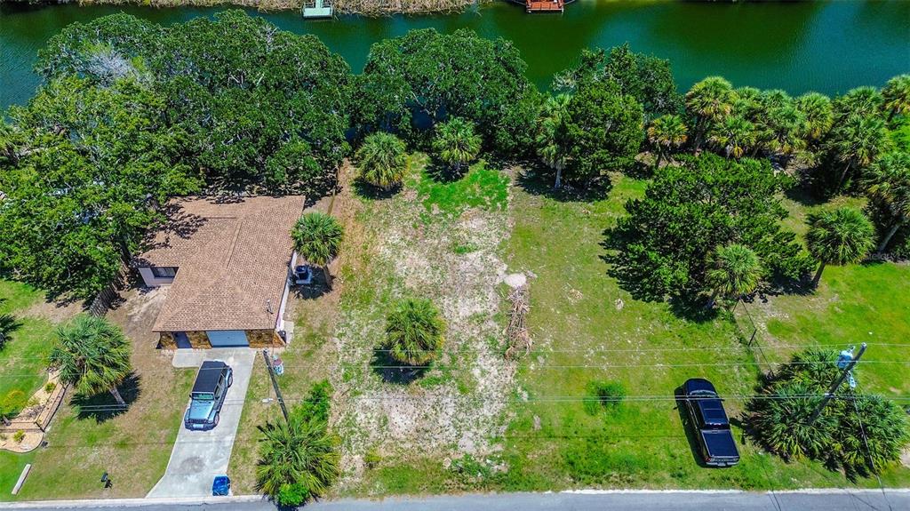 0 Sea Grape Drive, Unit LOT 10 Hernando Beach, FL 34607 - Photo 13 of 23 an aerial view of residential house with outdoor space and trees all around
