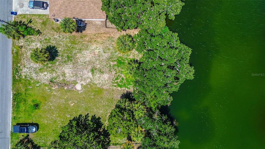 0 Sea Grape Drive, Unit LOT 10 Hernando Beach, FL 34607 - Photo 14 of 23 an aerial view of a residential houses with outdoor space and trees all around