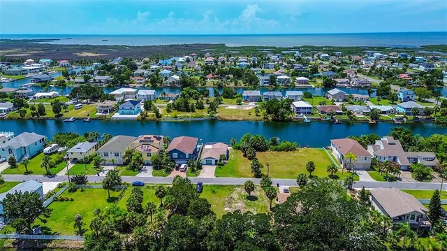 an aerial view of a houses with a lake view