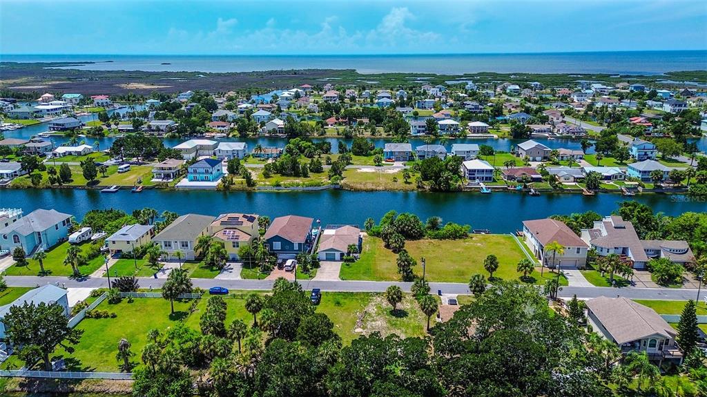 0 Sea Grape Drive, Unit LOT 10 Hernando Beach, FL 34607 - Photo 17 of 23 an aerial view of a houses with a lake view