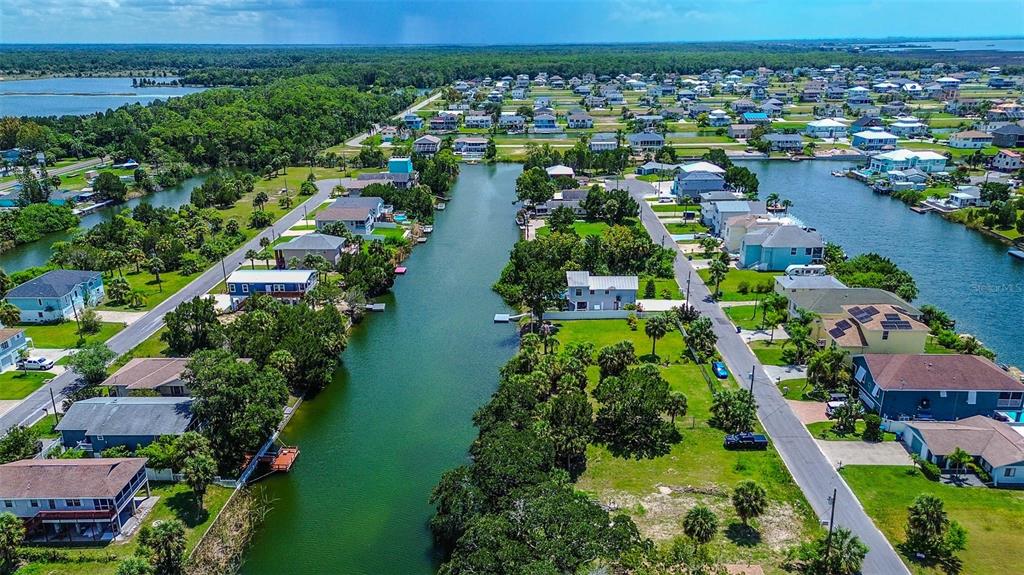 0 Sea Grape Drive, Unit LOT 10 Hernando Beach, FL 34607 - Photo 18 of 23 an aerial view of city and lake view