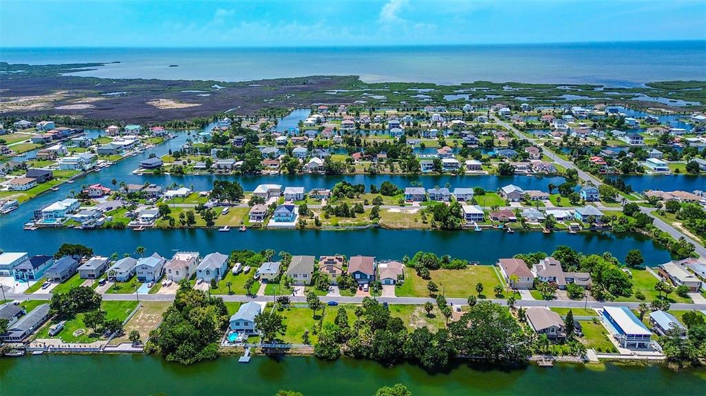 0 Sea Grape Drive, Unit LOT 10 Hernando Beach, FL 34607 - Photo 2 of 23 a view of a lake with a lots of house ocean view