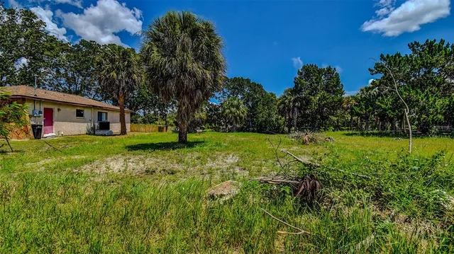 a view of a house with a big yard