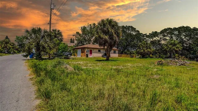 a house view with swimming pool in front of it