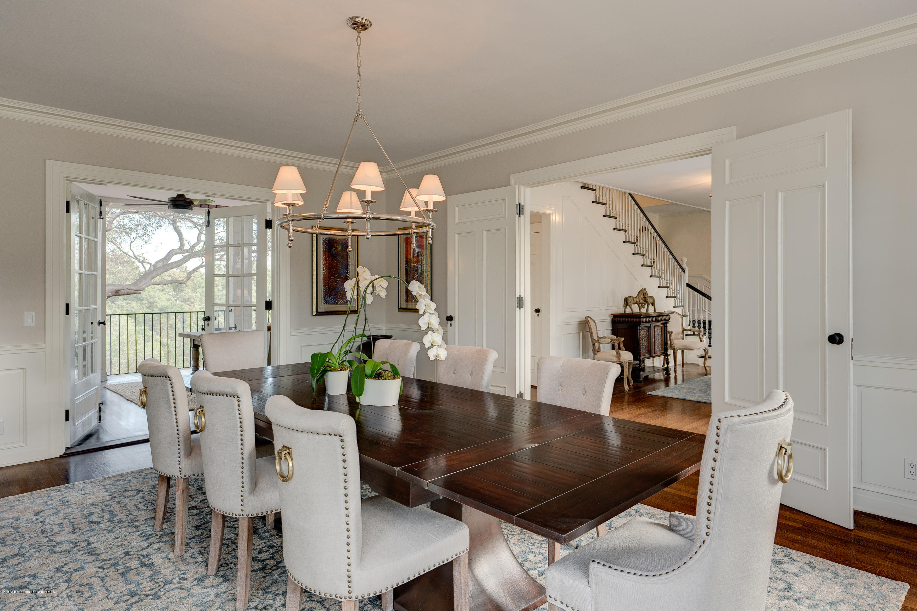 1234 Hillcrest Avenue Pasadena, CA 91106 - Photo 14 of 82 a dining room with furniture a chandelier and wooden floor