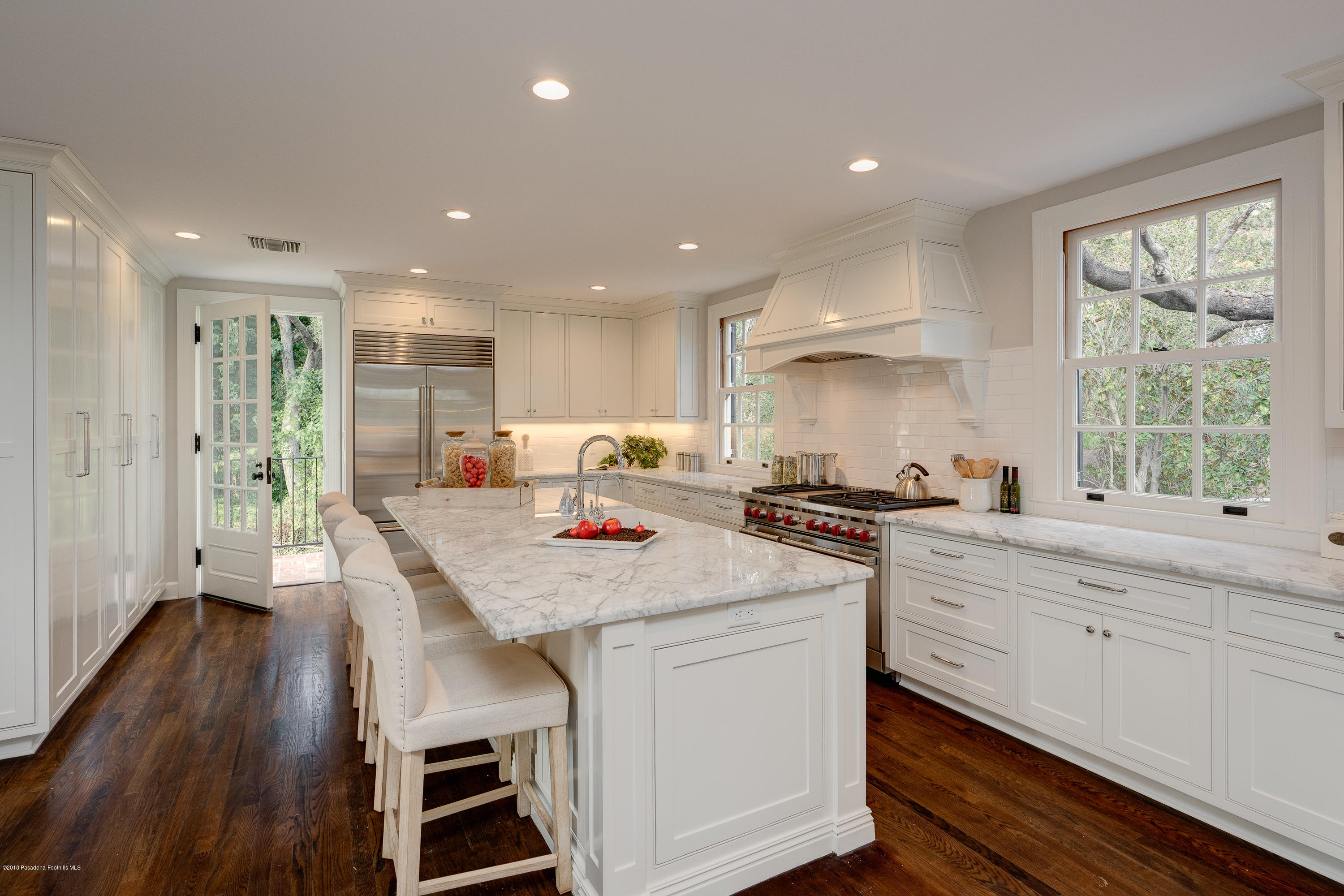 1234 Hillcrest Avenue Pasadena, CA 91106 - Photo 15 of 82 a kitchen with appliances wooden floor and a window