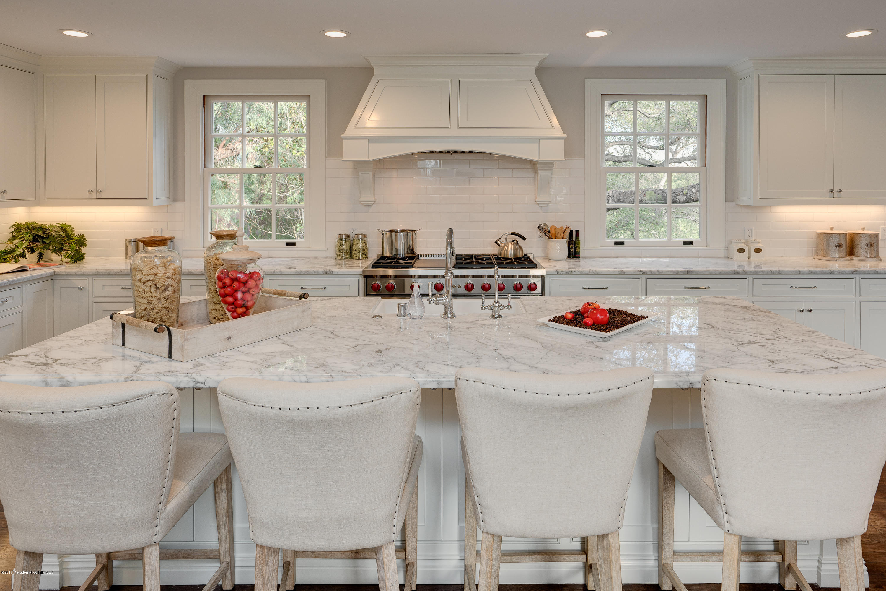 1234 Hillcrest Avenue Pasadena, CA 91106 - Photo 18 of 82 a kitchen with stainless steel appliances white cabinets and wooden floor