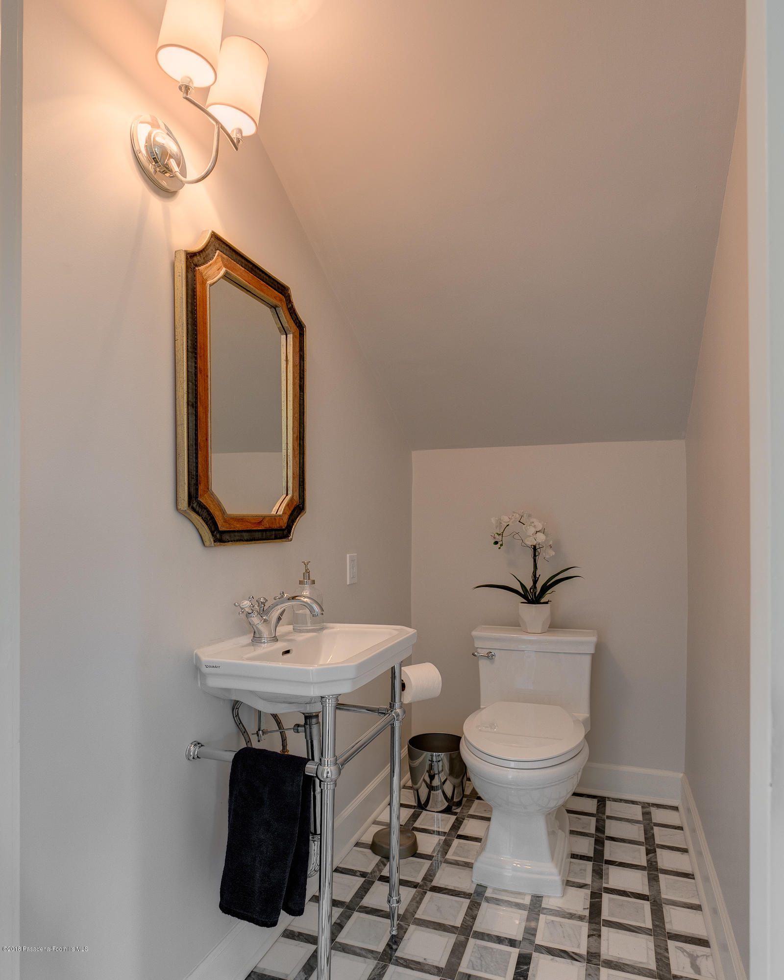 1234 Hillcrest Avenue Pasadena, CA 91106 - Photo 25 of 82 a bathroom with a toilet a sink and mirror