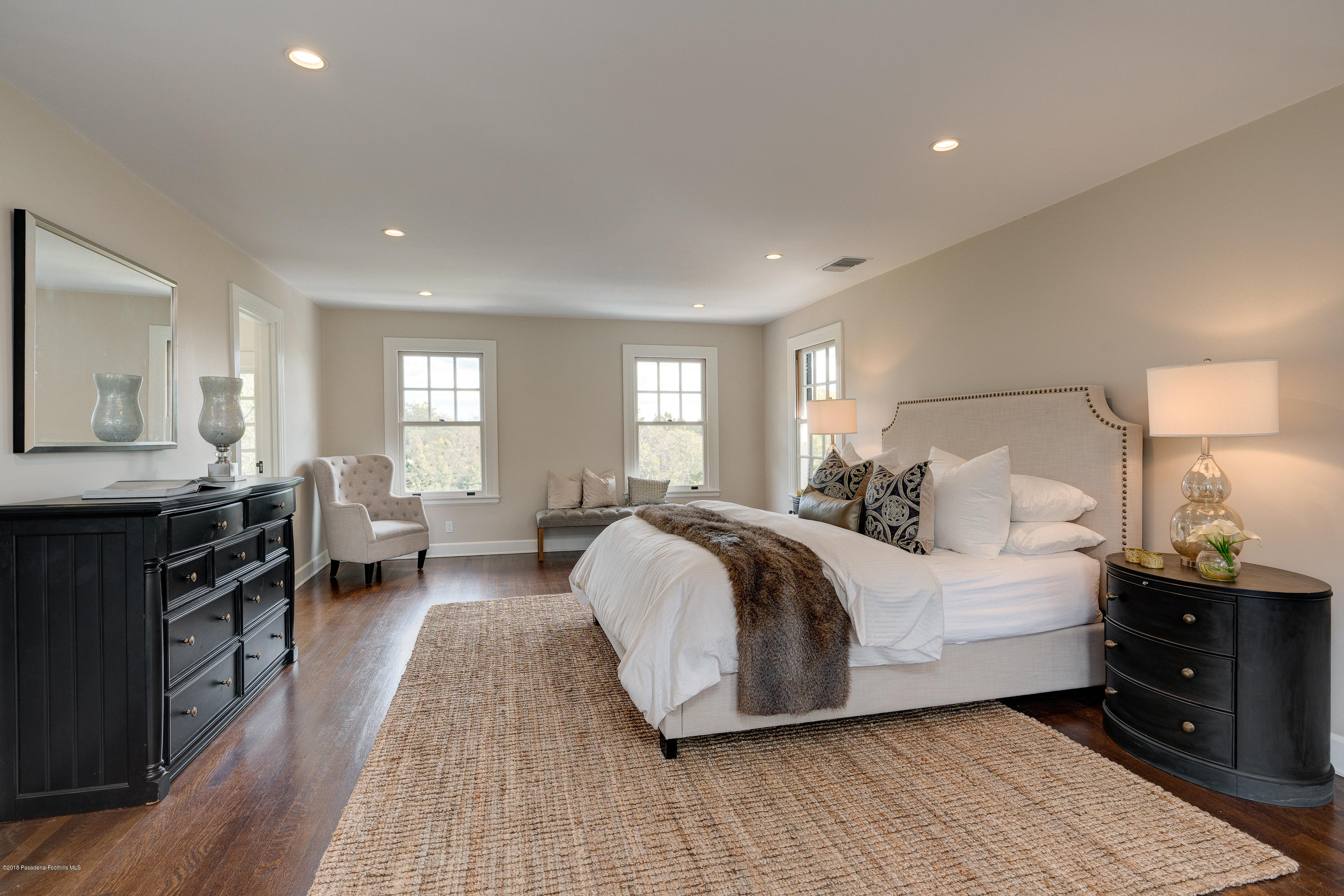 1234 Hillcrest Avenue Pasadena, CA 91106 - Photo 30 of 82 a spacious bedroom with a bed and wooden floor