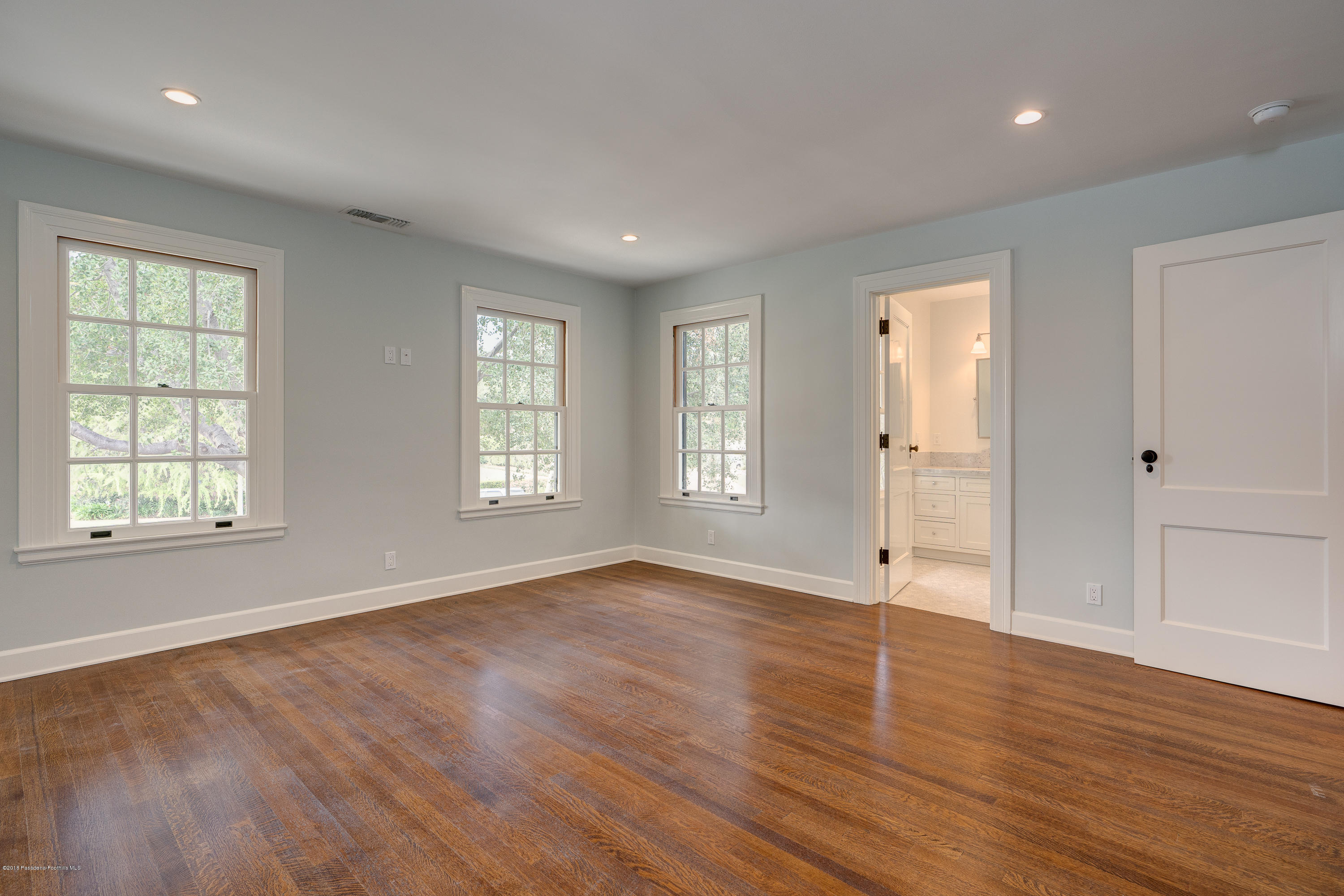1234 Hillcrest Avenue Pasadena, CA 91106 - Photo 38 of 82 a view of an empty room with wooden floor and a window