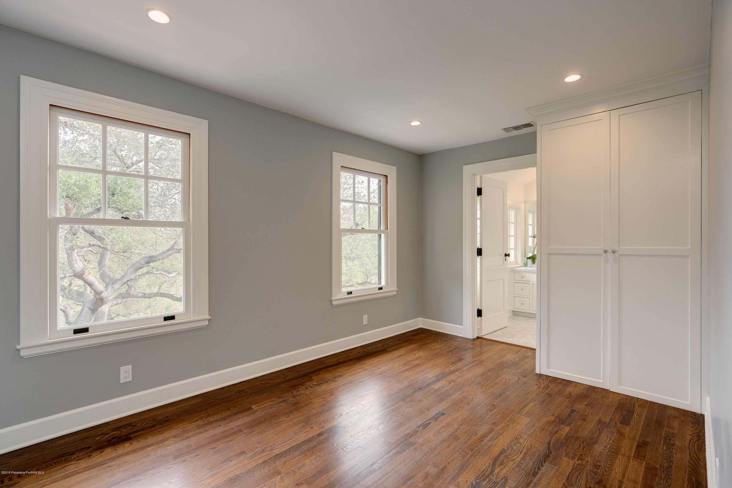1234 Hillcrest Avenue Pasadena, CA 91106 - Photo 40 of 82 a view of an empty room with wooden floor and a window