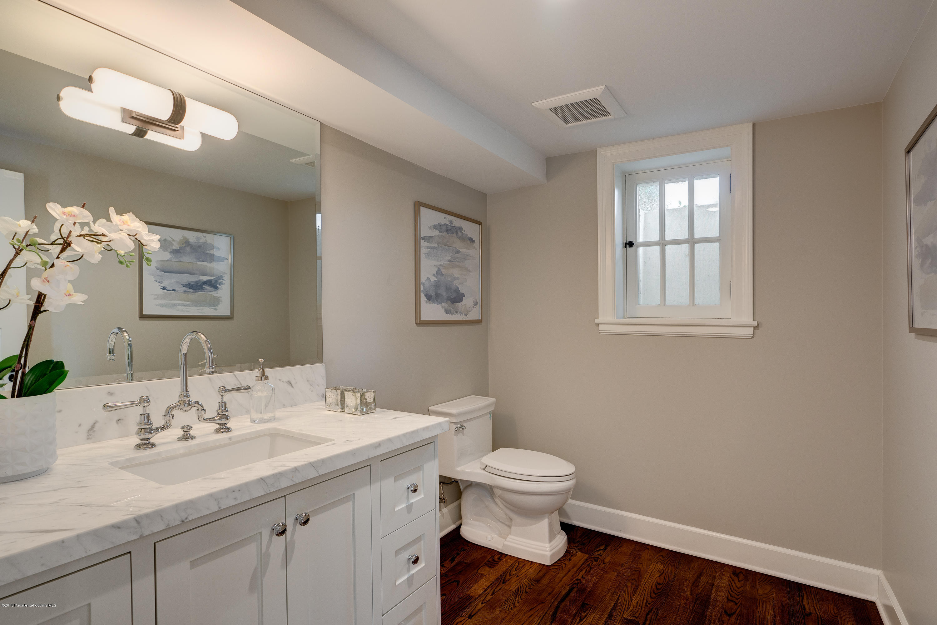 1234 Hillcrest Avenue Pasadena, CA 91106 - Photo 45 of 82 a bathroom with a sink toilet and a mirror