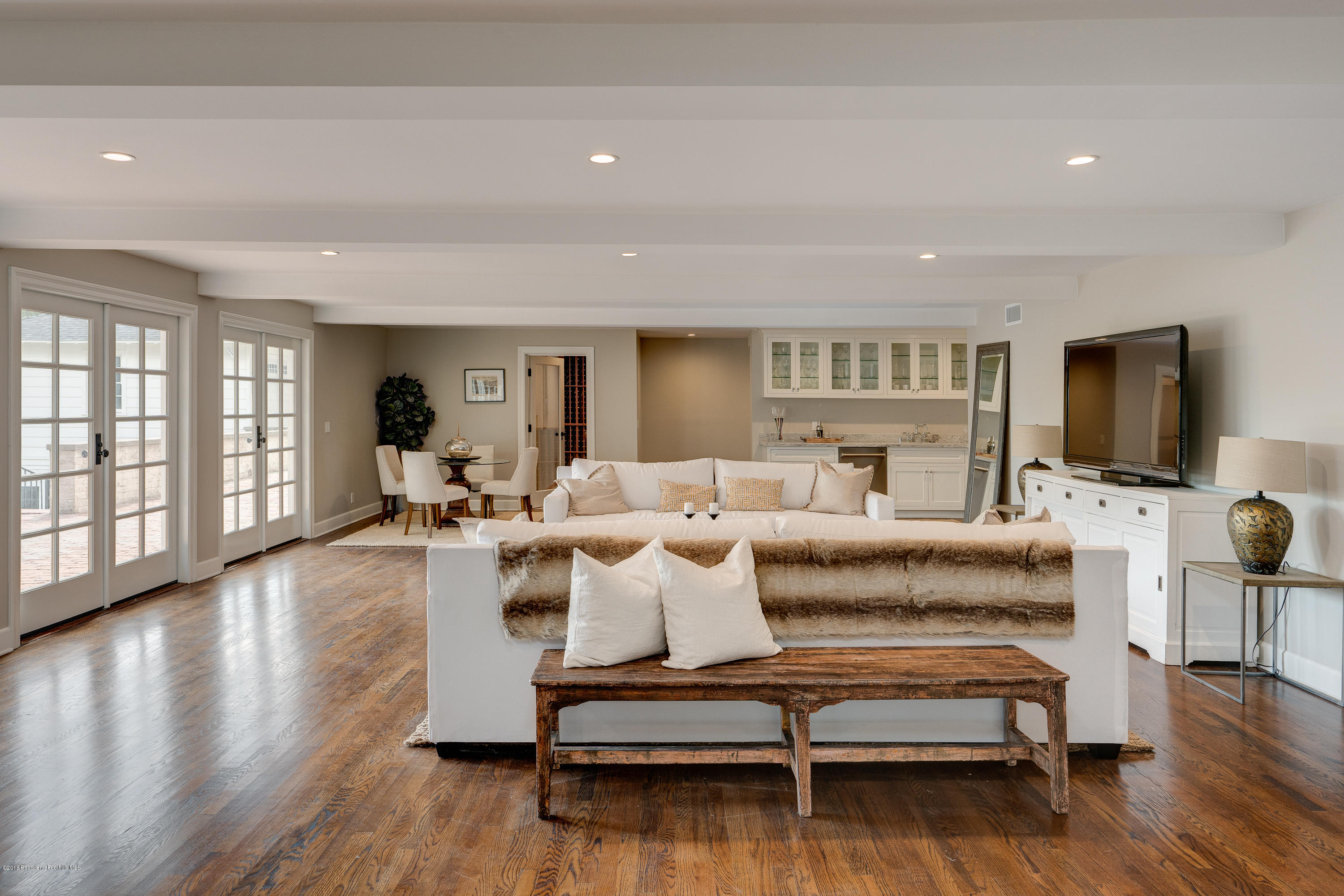 1234 Hillcrest Avenue Pasadena, CA 91106 - Photo 50 of 82 a living room with furniture flat screen tv and wooden floor