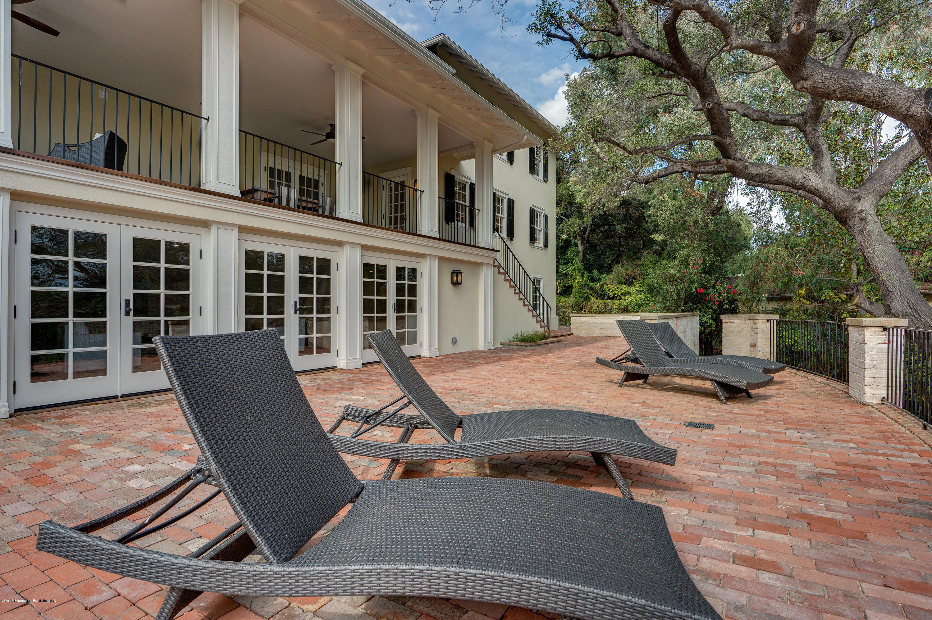 1234 Hillcrest Avenue Pasadena, CA 91106 - Photo 60 of 82 a view of a patio with a table and chairs