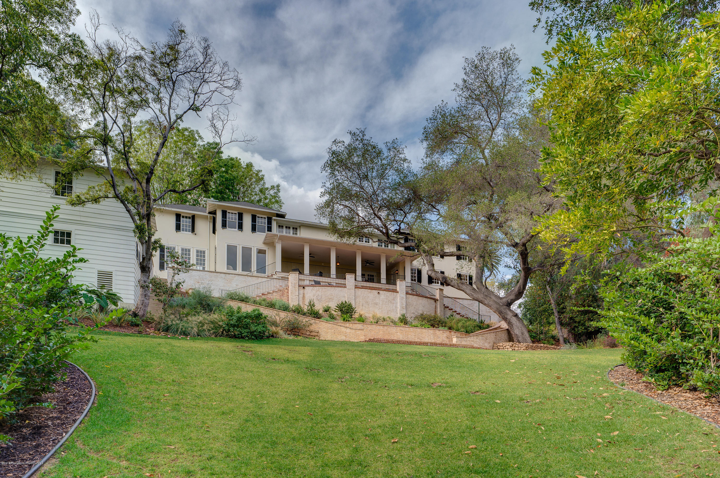 1234 Hillcrest Avenue Pasadena, CA 91106 - Photo 66 of 82 a view of a house with a yard deck and a large tree