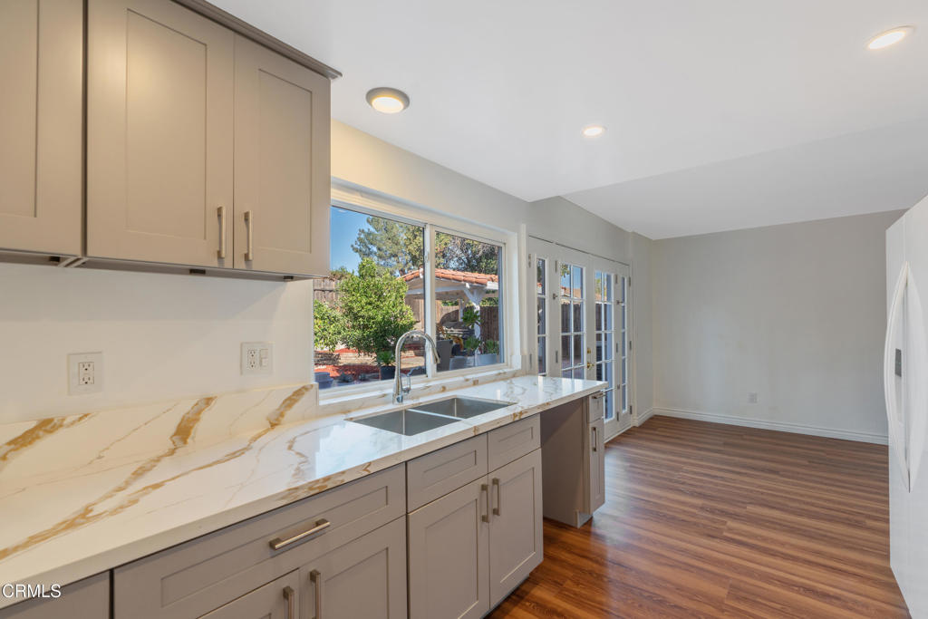 18719 Chase Street Northridge, CA 91324 - Photo 12 of 32 a kitchen with sink and cabinets