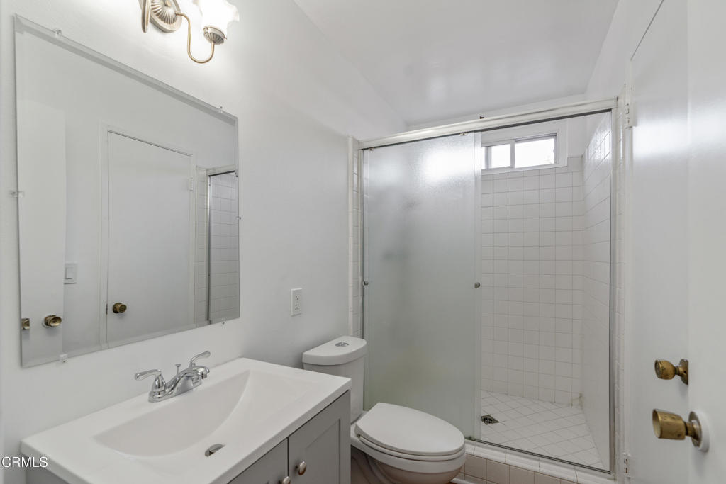 18719 Chase Street Northridge, CA 91324 - Photo 16 of 32 a bathroom with a sink a toilet and shower