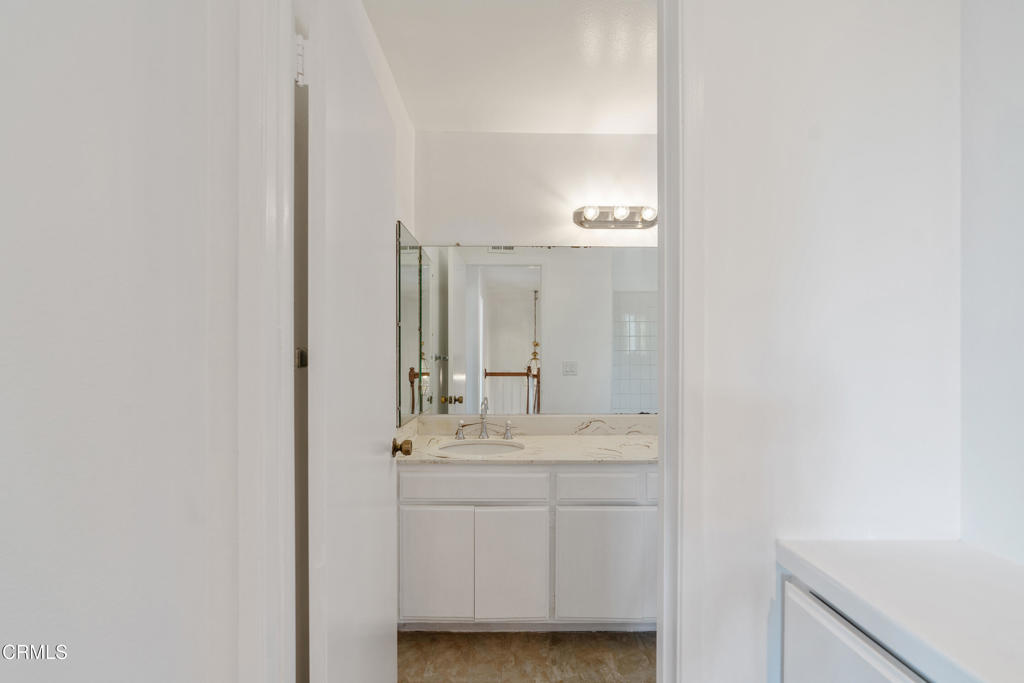 18719 Chase Street Northridge, CA 91324 - Photo 19 of 32 a bathroom with a sink and a mirror