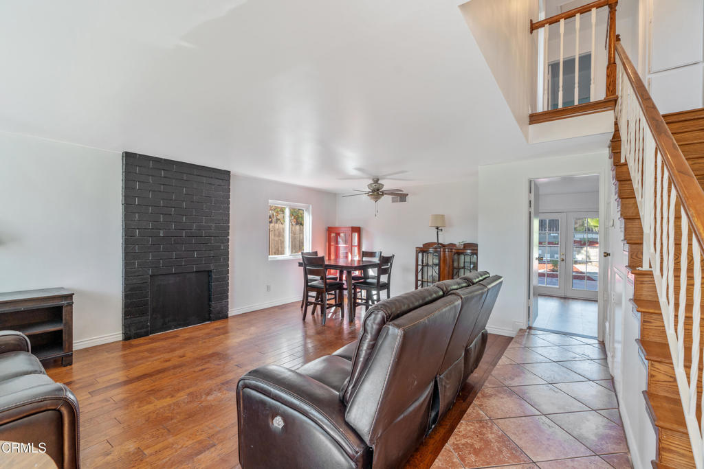 18719 Chase Street Northridge, CA 91324 - Photo 2 of 32 a living room with furniture and a wooden floor