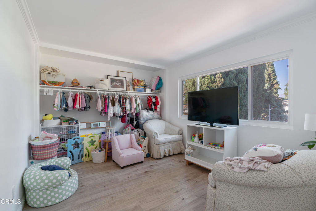 18719 Chase Street Northridge, CA 91324 - Photo 23 of 32 a living room with furniture and a flat screen tv