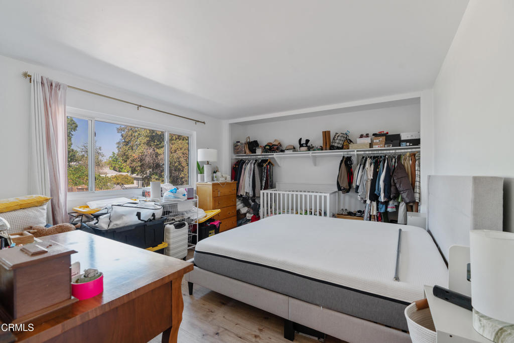 18719 Chase Street Northridge, CA 91324 - Photo 24 of 32 a bed room with a bed and a window