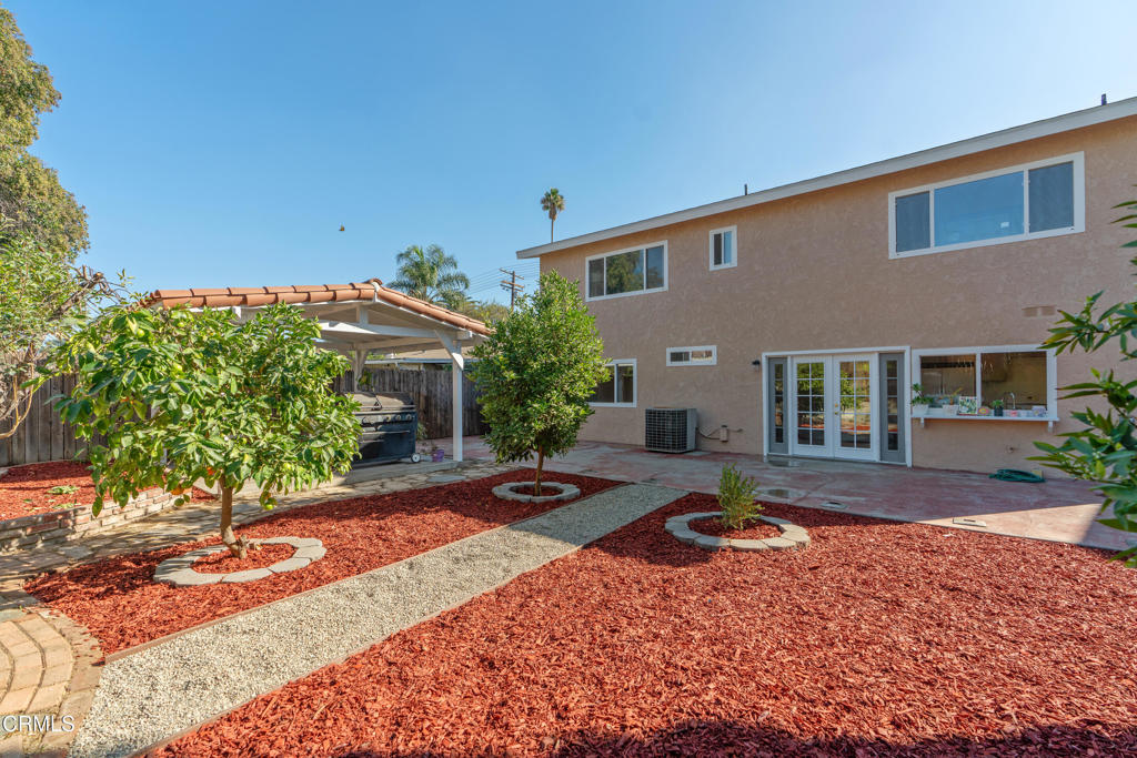 18719 Chase Street Northridge, CA 91324 - Photo 27 of 32 a front view of a house with garden