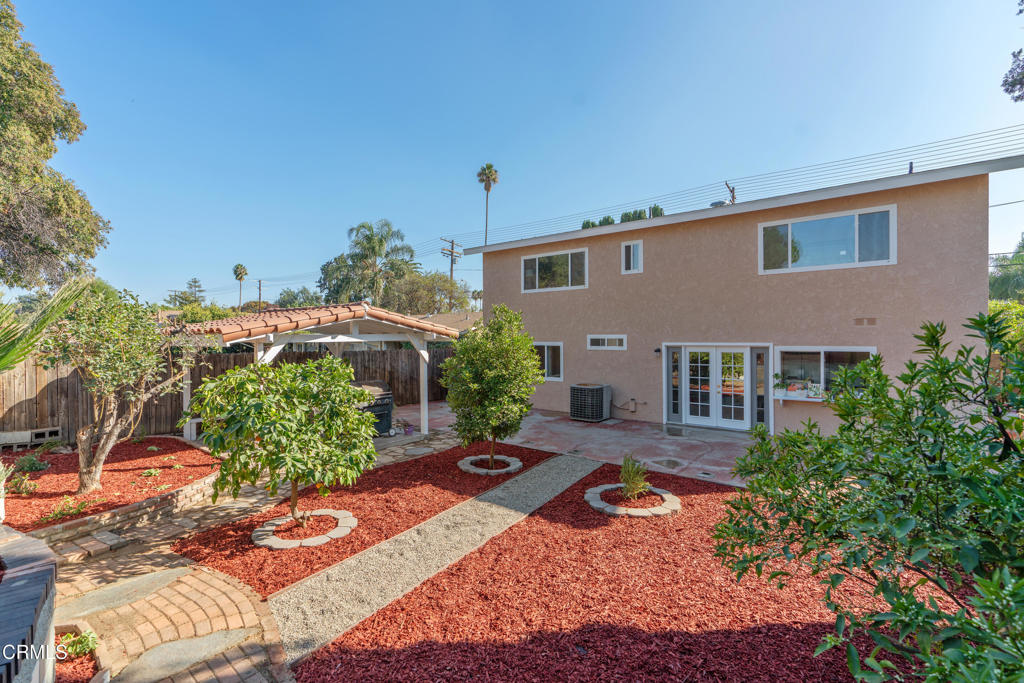 18719 Chase Street Northridge, CA 91324 - Photo 28 of 32 a backyard of a house with yard and outdoor seating