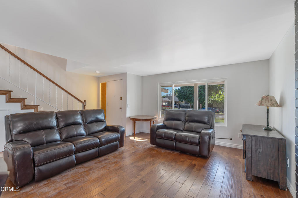 18719 Chase Street Northridge, CA 91324 - Photo 6 of 32 a living room with furniture and a large window