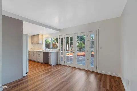 a room with a wooden floor and window