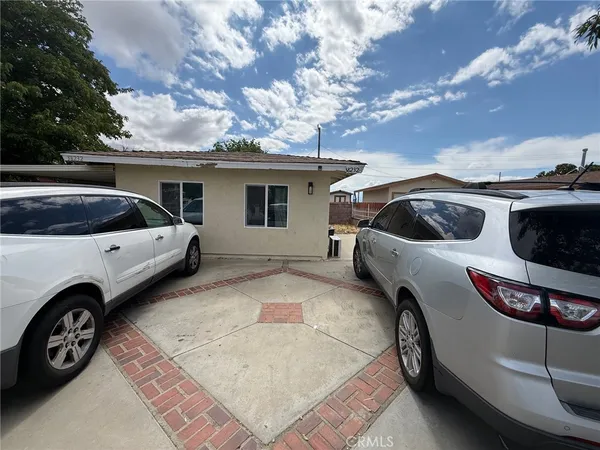 a view of a car parked in front of a house