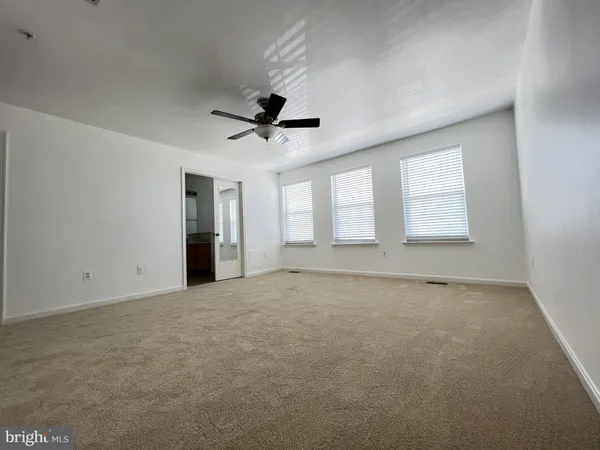 a bathroom with a shower sink and mirror