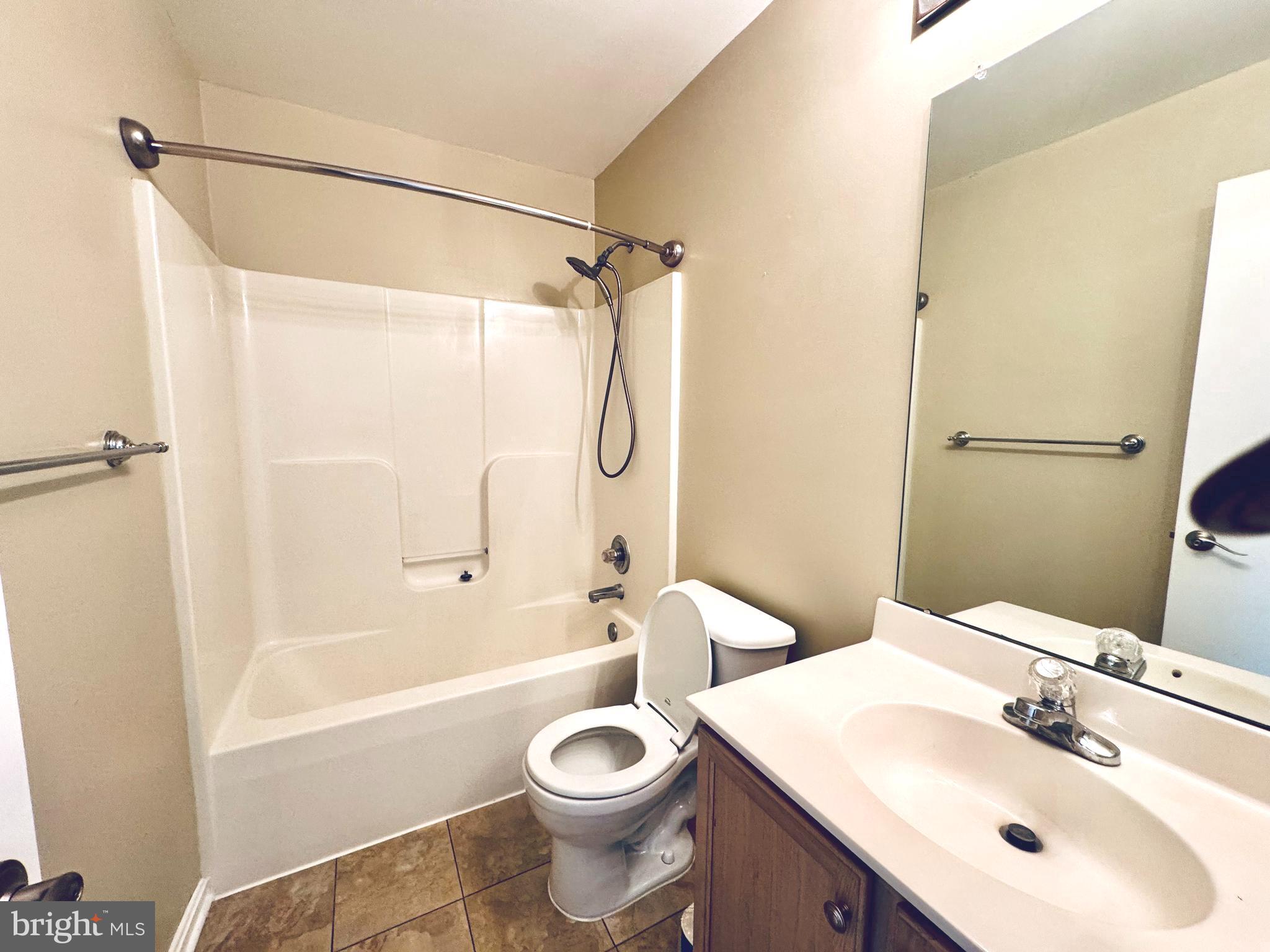 4971 Clarendon Terrace Frederick, MD 21703 - Photo 24 of 35 a bathroom with a sink toilet and shower