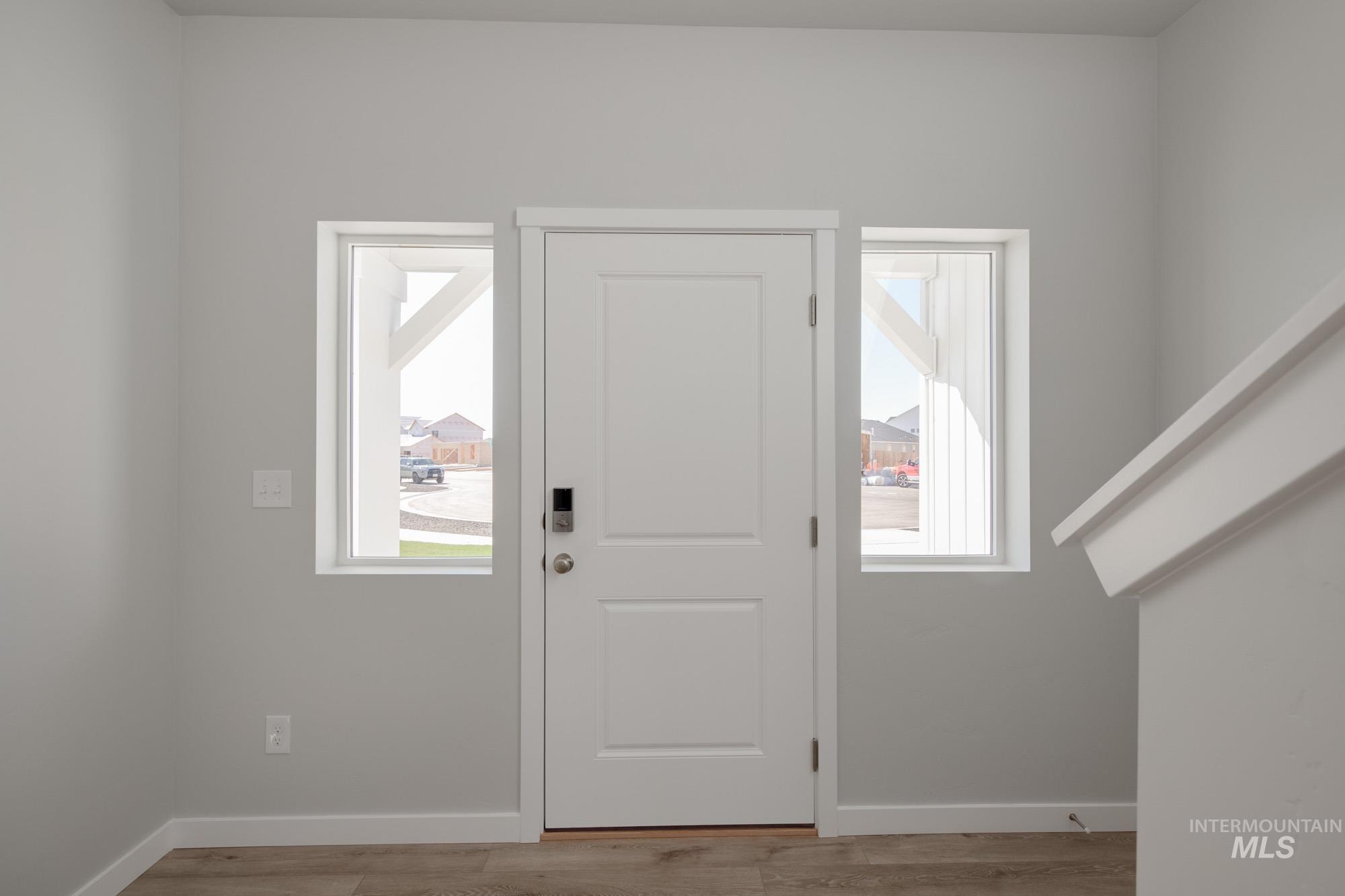 13708 Judson Street Caldwell, ID 83607 - Photo 2 of 32 Foyer entrance featuring light wood-type flooring and plenty of natural light