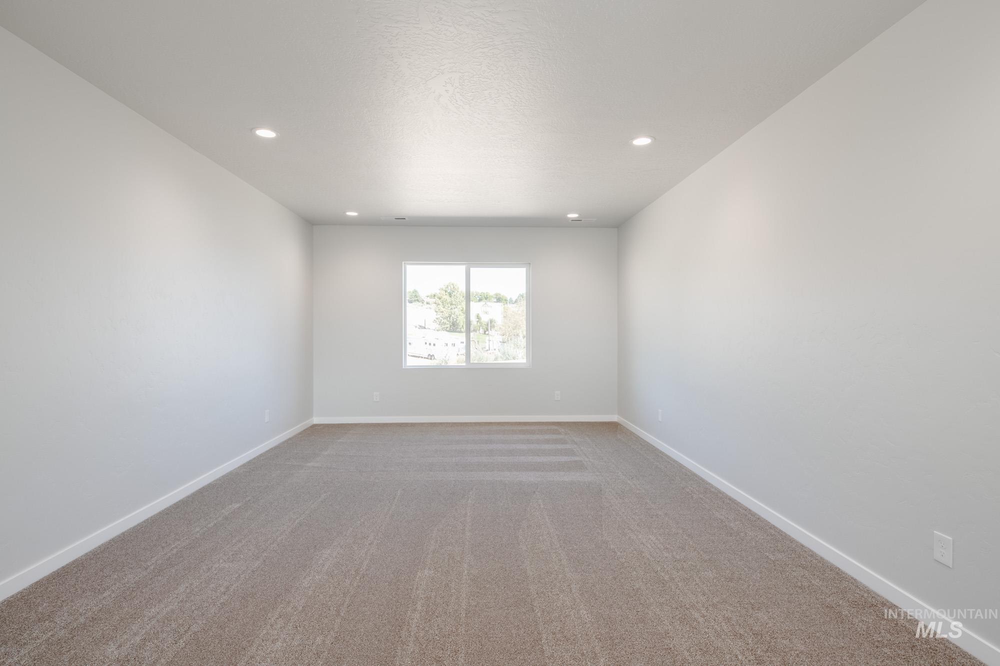 13708 Judson Street Caldwell, ID 83607 - Photo 24 of 32 Unfurnished room with light colored carpet and recessed lighting