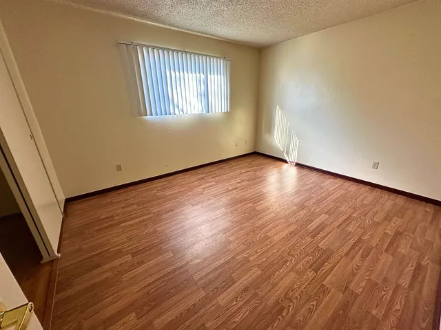 a room with gym equipment and a shower