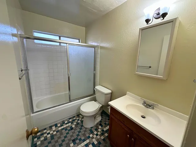 a view of an empty room with stairs