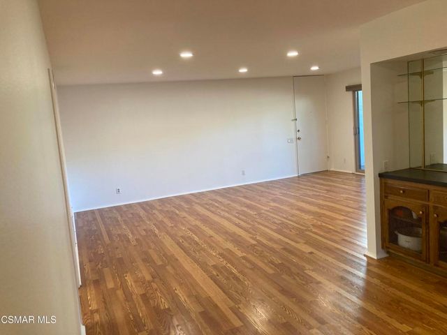 a view of a livingroom with wooden floor