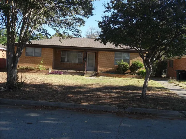 a view of house with yard