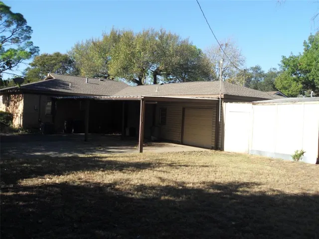 a house with trees in the background