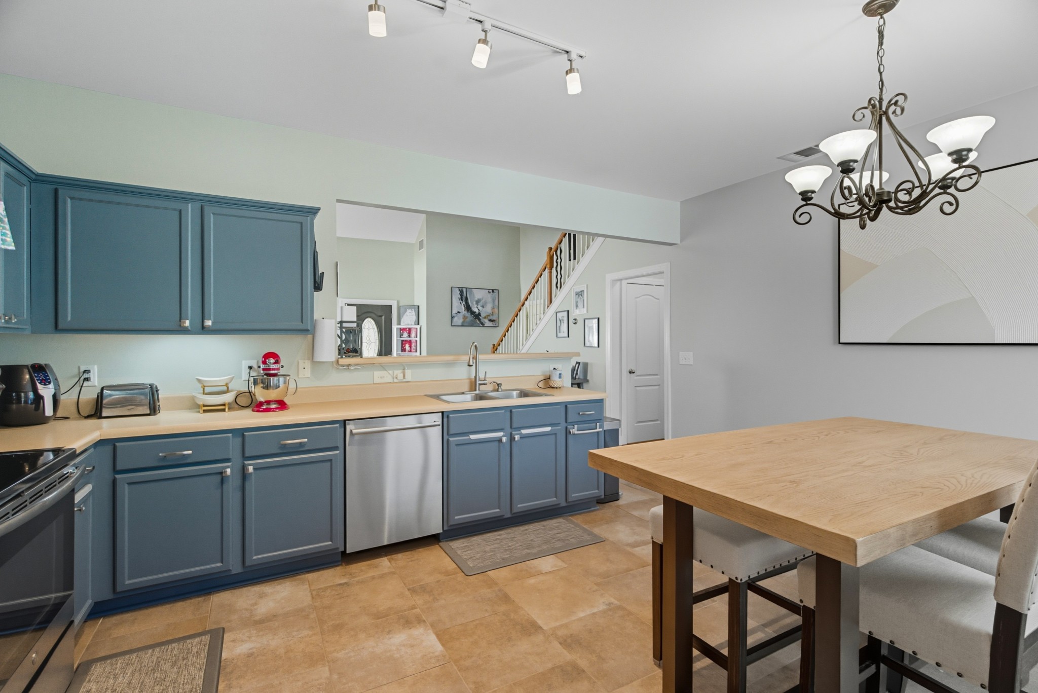 1511 Saddle View Mount Juliet, TN 37122 - Photo 11 of 52 a kitchen with a table chairs sink and cabinets