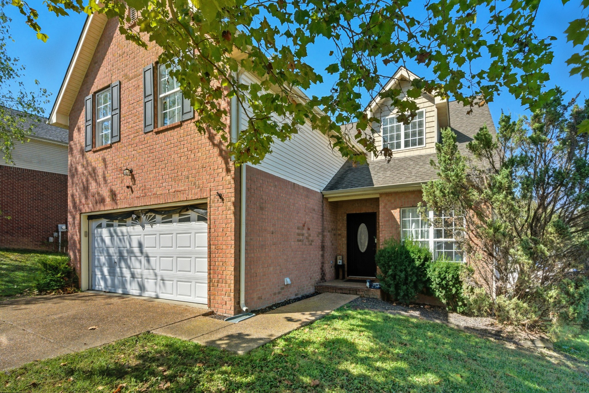 1511 Saddle View Mount Juliet, TN 37122 - Photo 2 of 52 a front view of a house with a yard and garage