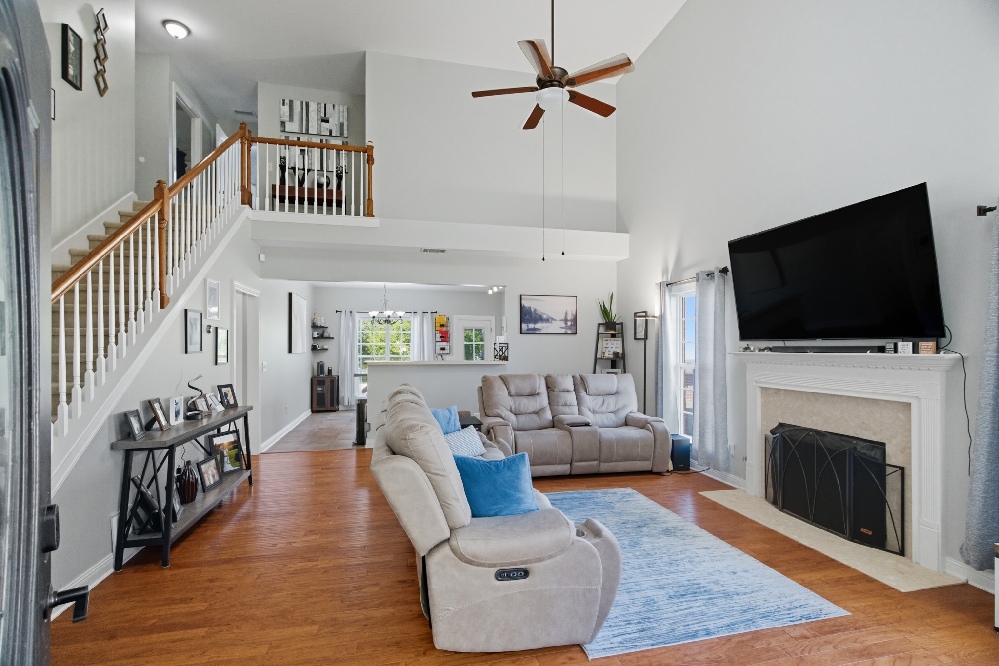 1511 Saddle View Mount Juliet, TN 37122 - Photo 3 of 52 a living room with furniture a flat screen tv and a fireplace
